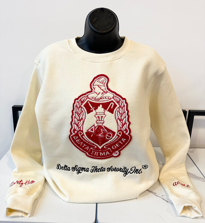 Delta Cream Shield Sweatshirt